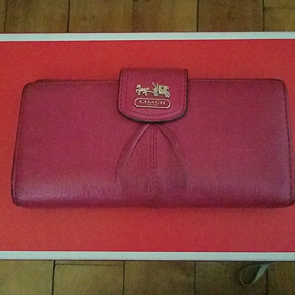 Coach Ashley slim envelope wallet in pink leather.